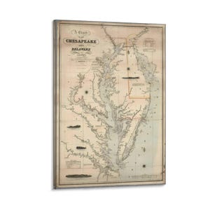 May include: A vintage map print titled "A Chart of Chesapeake and Delaware Bays." The map features detailed coastlines, waterways, and text in a classic, aged style. The print has a neutral color palette with a framed border.