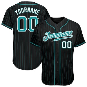 May include: Black baseball jersey with teal pinstripes, teal accents, and the text "Teamname" on the front. The back of the jersey has the text "Yourname" and the number "00". The jersey has a button-up front and short sleeves.