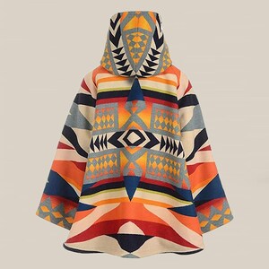 May include: A hooded poncho with a vibrant geometric pattern in shades of orange, red, blue, and cream. The design features triangles, diamonds, and stripes, creating a colorful and eye-catching look. The poncho is a cozy outerwear garment.