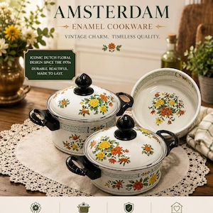 May include: Two white enamel pots with black handles and lids, decorated with yellow and orange floral patterns. The text reads Villeroy & Boch 1748 AMSTERDAM ENAMEL COOKWARE, ICONIC DUTCH FLORAL DESIGN SINCE THE 1970S, and other descriptive marketing text.