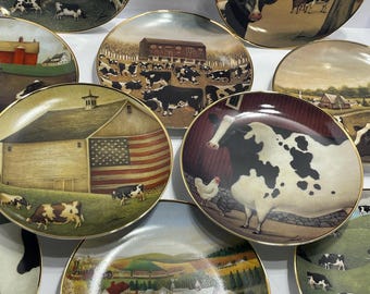 American Folk Art Collectors plates,  depicting farm scenes with cows.