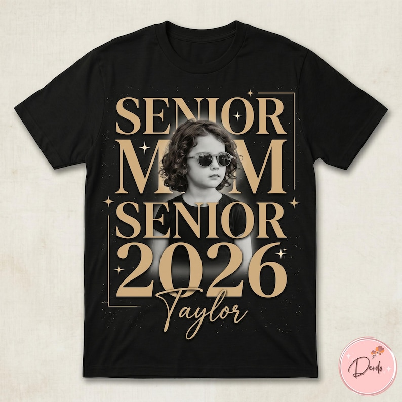 May include: Black t-shirt with a photo of a person wearing sunglasses, with the words "SENIOR MOM SENIOR 2026 Taylor" in gold lettering. The design includes stars and a gold border.