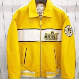 May include: Yellow jacket with a white stripe across the chest and sleeves. The jacket has a zipper closure and a collar. The brand name "AVIREX" is displayed on the chest, and a patch with the number "75" is on the sleeve.