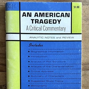 May include: A Study*Master publication titled An American Tragedy: A Critical Commentary. The cover features a geometric design in blue, lime green, and black with white text. It lists contents including biographical information and plot analysis.