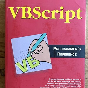 May include: A red VBScript Programmer's Reference book with yellow text. The cover features a graphic of a hand holding a blue pen over the letters VB on a grid. It includes the subtitle A comprehensive guide to version 5 of the VBScript language.