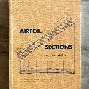 May include: A textured light orange book cover titled AIRFOIL SECTIONS by John Malkin. The cover features a black technical line drawing of an airfoil shape and grid lines. The bottom text reads: CONTAINING THE WORLDS BEST COLLECTION SUITABLE FOR ALL TYPES OF MODELS.