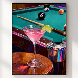 Puede incluir: Impresión enmarcada de una naturaleza muerta con un cóctel rosa, una mesa de billar con bolas y un taco. El texto "RSM Digital Prints" aparece en la parte inferior.