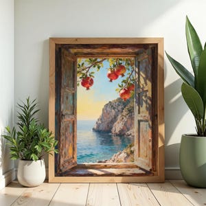 Puede incluir: Pintura enmarcada que representa una escena costera vista a través de una ventana abierta. La obra presenta un mar azul vibrante, acantilados rocosos y ramas de granadas. El marco es de madera clara. La pintura está apoyada contra una pared.