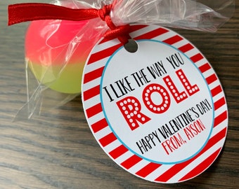 May include: A red and white striped circle tag with the text "I like the way you roll" in red letters with white polka dots. The tag also says "Happy Valentine's Day! From, Ayson".