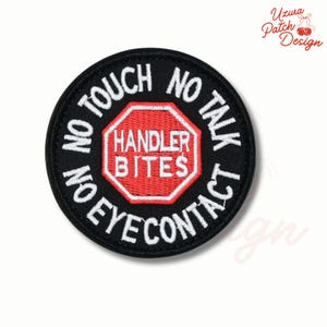 May include: A round black patch with white text that reads "NO TOUCH, NO TALK, NO EYE CONTACT, NO ON" around the edge. A red and white stop sign shape in the center reads "HANDLER BITES".