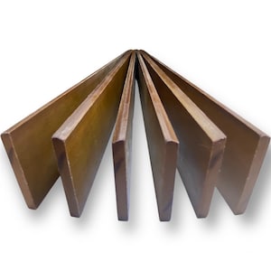 May include: Six wooden planks arranged in a fan shape. The planks are a warm brown color, with visible wood grain. The edges are slightly rounded. The planks are evenly spaced, creating a symmetrical pattern. The background is white.