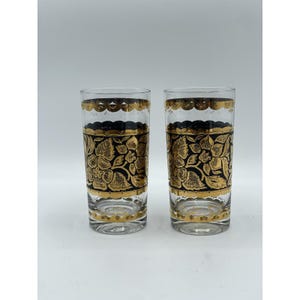 Set di 2 bicchieri highball Collins di Georges Briard con decorazioni floreali dorate e nere.