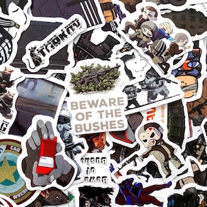 May include: A selection of stickers featuring military and gaming-related designs. The stickers depict cartoon characters, weapons, and phrases like "BEWARE OF THE BUSHES" and "ESCAPE FROM TARKOV". The stickers are in a variety of colours and styles.