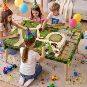 May include: Children playing with a toy play table with a green landscape design. The table has wooden legs and is surrounded by colorful toys, party hats, and balloons. The scene suggests a birthday party or a fun playdate.