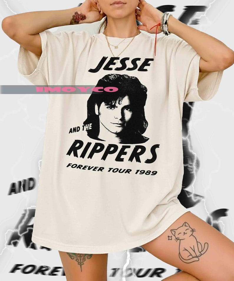 May include: Cream-colored t-shirt featuring a black and white graphic of a person and the text "JESSE AND THE RIPPERS FOREVER TOUR 1989". The shirt has a relaxed fit and short sleeves.