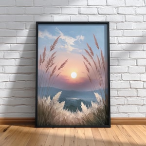 May include: Framed landscape art print featuring a sunset over a mountain range. The artwork showcases tall, feathery grasses in the foreground, framing the sun and sky. The color palette includes shades of blue, pink, and orange.