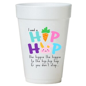 May include: White foam cup with a colorful graphic of the word "HIP HOP" with a bunny and carrot. The text below reads "I said a the hippie the hippie to the hip-hip hop & you don't stop..."