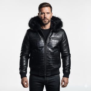 May include: Black leather jacket with a faux fur-lined hood. The jacket features a textured, crocodile-like pattern, a zip closure, and multiple pockets. The jacket has a ribbed hem and cuffs.
