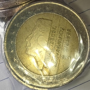 Vintage 2 euro coins featuring Beatrix, Queen of the Netherlands, years 2001 and 2002.