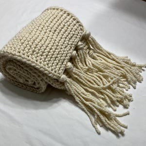 May include: A set of three ceramic mugs with a speckled, matte finish. The mugs are in shades of cream, light gray, and dark gray. Each mug has a simple, minimalist design, perfect for coffee or tea.