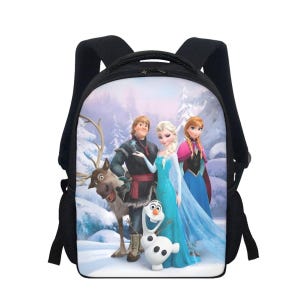 May include: Black backpack featuring a colorful graphic of characters from the animated movie Frozen. The backpack has a zippered main compartment, two side pockets, and adjustable shoulder straps. The image shows Elsa, Anna, Kristoff, Olaf, and Sven in a snowy forest setting.