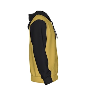 K&ouml;nnte beinhalten: Senfgelber Kapuzenpullover mit schwarzen &Auml;rmeln und Kapuze. Der Hoodie hat einen Kordelzug und eine K&auml;ngurutasche. Das Design ist ein l&auml;ssiger, bequemer Stil, der f&uuml;r den Alltag geeignet ist.