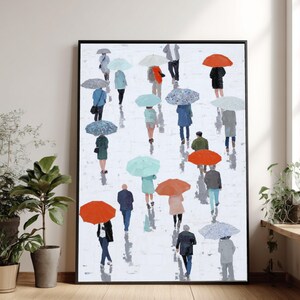 Könnte beinhalten: Ein gerahmter Kunstdruck, der eine Szene an einem Regentag zeigt. Figuren mit Regenschirmen in verschiedenen Farben, darunter Rot, Blau und Türkis, gehen auf einer weißen, strukturierten Oberfläche. Das Kunstwerk hat einen modernen, impressionistischen Stil.