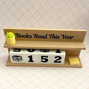 May include: A set of three ceramic mugs with a speckled, matte finish. Each mug is a different colour: light blue, cream, and grey. The mugs have a simple, modern design and a comfortable handle.