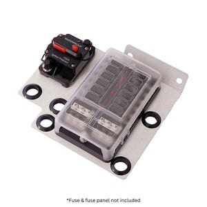 May include: A silver-colored fuse panel with a clear plastic cover, featuring multiple fuse slots and a black circuit breaker labeled "WATERPROOF" and "120A". The panel is mounted on a metal plate with black rubber grommets. The text "Ignition Protected" is visible.