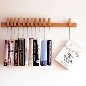 Book rack in Oak by AGUSTAV / Original design floating bookshelf / pins double as bookmarks / bookart / Hanging books / Unique book display. image 3