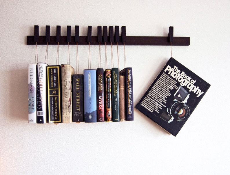 Book rack in fumed oak. Hanging bookshelf. Book hanger in dark wood. Pins work as bookmarks. Bookcasw. Floating bookshelf. Unique library. image 1