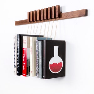 Custom made wooden book rack / bookshelf in Walnut. Pins also work as bookmarks. Bookcase image 2