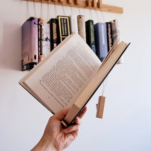 Book rack in Oak by AGUSTAV / Original design floating bookshelf / pins double as bookmarks / bookart / Hanging books / Unique book display. image 5