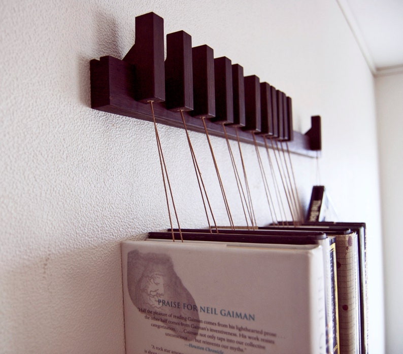 Book rack in fumed oak. Hanging bookshelf. Book hanger in dark wood. Pins work as bookmarks. Bookcasw. Floating bookshelf. Unique library. image 3