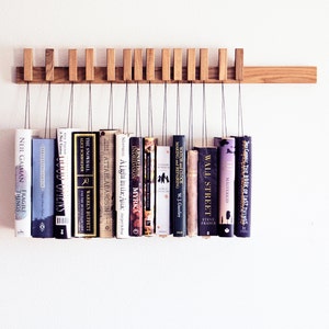 Book rack in Oak by AGUSTAV / Original design floating bookshelf / pins double as bookmarks / bookart / Hanging books / Unique book display. image 1