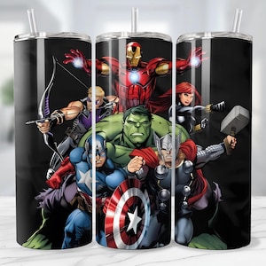 May include: A black tumbler featuring a vibrant illustration of the Avengers superhero team. The design includes Iron Man, Captain America, Hulk, Thor, Black Widow, Hawkeye, and other characters. The tumbler has a silver lid and a clear straw.