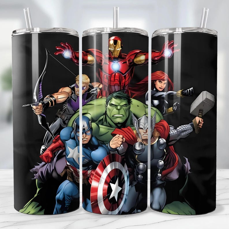 May include: A black tumbler featuring a vibrant illustration of the Avengers superhero team. The design includes Iron Man, Captain America, Hulk, Thor, Black Widow, Hawkeye, and other characters. The tumbler has a silver lid and a clear straw.
