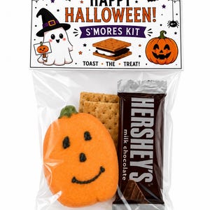 May include: A clear plastic bag containing a s'mores kit with a pumpkin-shaped cookie, graham crackers, and a Hershey's milk chocolate bar. The header card reads HAPPY HALLOWEEN! S'MORES KIT TOAST THE TREAT! with ghost and pumpkin graphics.