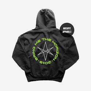 May include: Black hooded sweatshirt with the text "BRING ME THE HORIZON" in a neon green circular design. A white starburst graphic is in the center. The text "2019" is below the circle. The brand name "MOSHPIT APPARELS" is on a black circle.