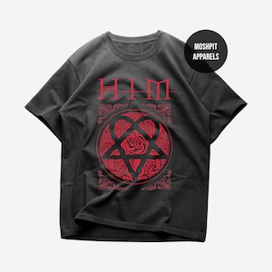 May include: Dark grey t-shirt with a red graphic. The graphic features the word "HIM" above a circular design of roses and leaves. The shirt also has a "MOSHPIT APPARELS" logo.