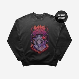 May include: Dark gray sweatshirt featuring a detailed graphic of a fantasy character with a small animal, surrounded by ornate, stylized text and design elements in shades of purple and red. The sweatshirt has a crew neck and long sleeves.