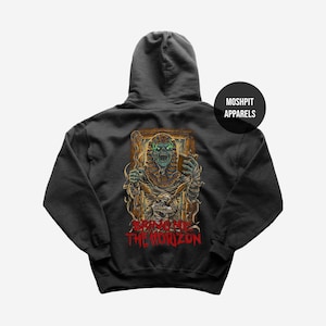 May include: Dark gray hoodie featuring a detailed illustration of a skeletal pharaoh holding a book, with the text "BRING ME THE HORIZON" in red. The hoodie has a hood and a round logo that says "MOSHPIT APPARELS".
