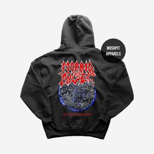 May include: A black hooded sweatshirt featuring a graphic design on the back. The design includes the words "MORBID ANGEL" in red and white, with a detailed illustration below. The text "ALTARS OF MADNESS" is printed at the bottom.