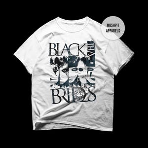 May include: White t-shirt featuring a graphic design with the text "BLACK VEIL BRIDES" in a distressed font. The design includes a collage of faces in black and white. The shirt has short sleeves and a crew neck.