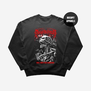 May include: Black crewneck sweatshirt with a red and white graphic of a skull and mechanical components. The text "FALL INTO THE DARKSIDE" is below the graphic. The brand name "MOSHPIT APPARELS" is on a black circle.