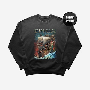 May include: Dark gray sweatshirt featuring the word "EPICA" in gold lettering above a detailed illustration of a ship at sea. The artwork depicts a stormy scene with a mermaid and a burning background. The brand name "MOSHPIT APPARELS" is in a black circle.