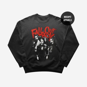 May include: Black crew neck sweatshirt with a red "Fall Out Boy" graphic and a black and white image of the band. The sweatshirt also has the text "Moshpit Apparels" in a black circle.