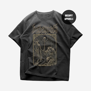 May include: Dark gray t-shirt featuring a gold illustration of figures in a gothic style. The word "Behemoth" is at the top, with the text "Moshpit Apparels" in a circle on the upper right.
