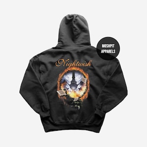 May include: Dark gray hooded sweatshirt with the word "Nightwish" in orange script above a circular graphic. The graphic features a moon, a figure, and flames. The brand name "Moshpit Apparels" is printed on a black circle.