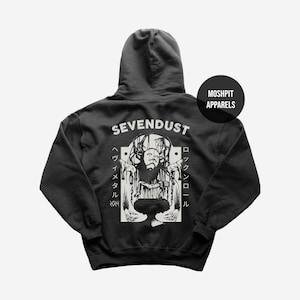 May include: Dark gray hoodie featuring a white graphic of a figure with long hair and the band name "SEVENDUST". The hoodie also has Japanese text and the brand name "MOSHPIT APPARELS".